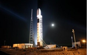 The Falcon 9 launch vehicle consists of a payload nacell atop two stages. Stage one consists of nine engines (lower black band) fed by a fuel tank above it. Stage two consists of one engine (upper black band) and a corresponding fuel tank.